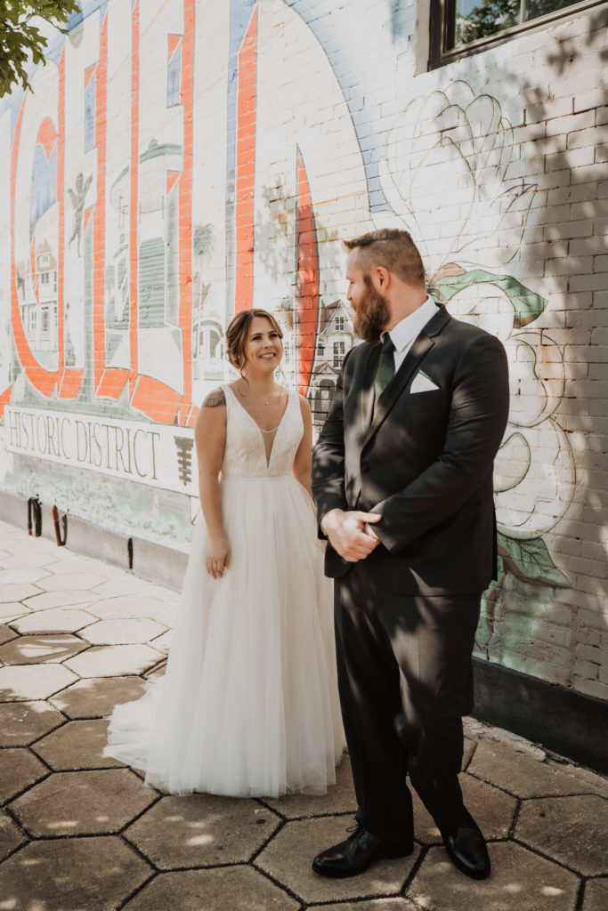 groom seeing bride for the first time at brick and beam