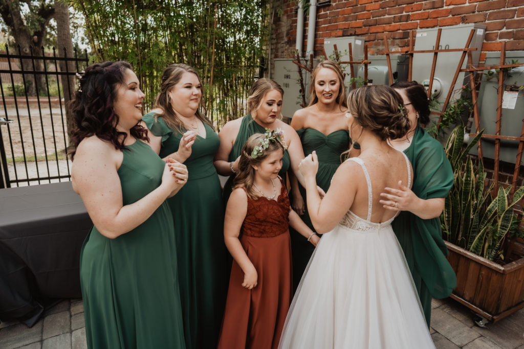 bridesmaids looking at bride