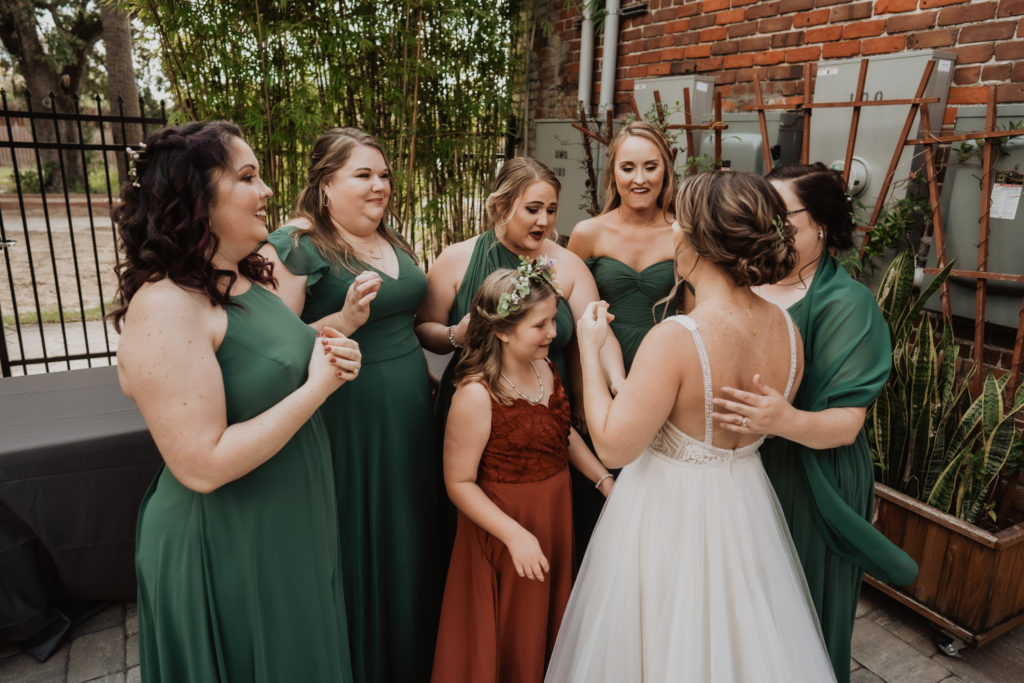 bride and bridesmaids first look