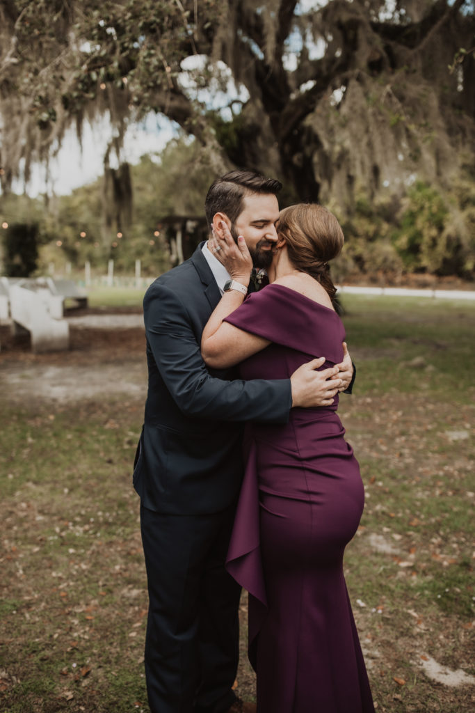 mother kissing son at ever after farms