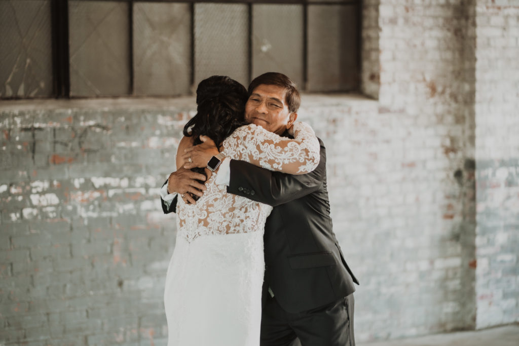 bride and dad first look at glass factory