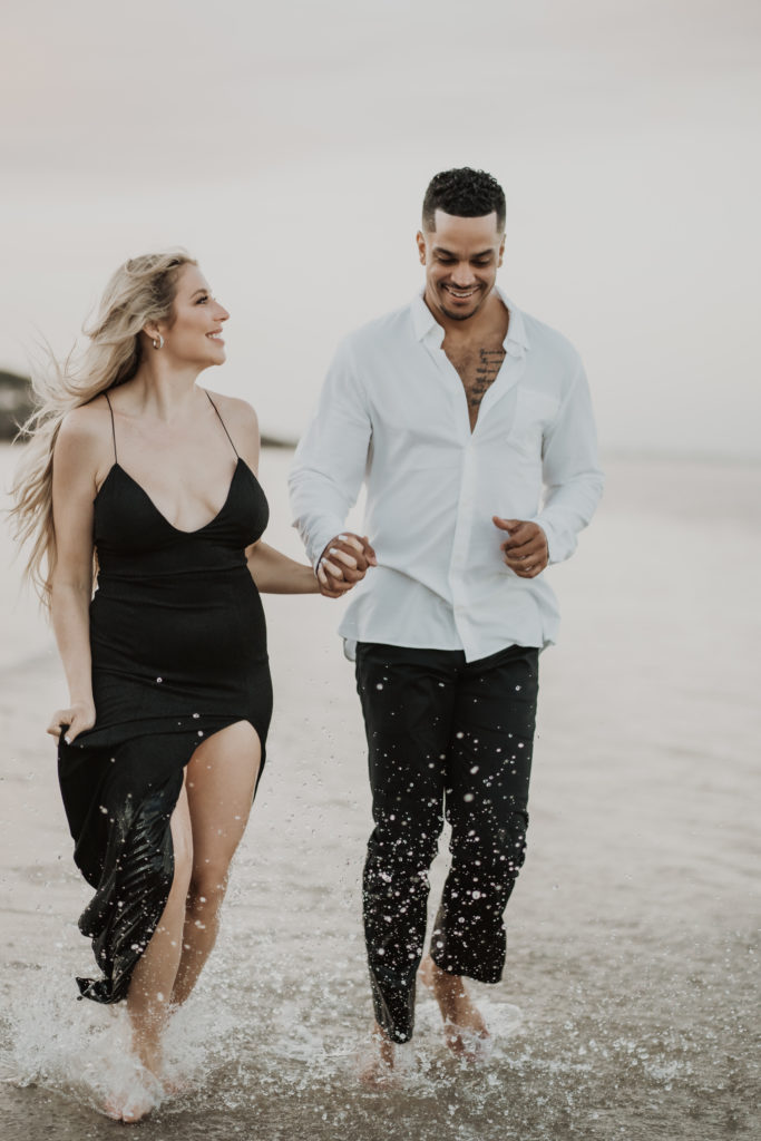 couple running on the beach